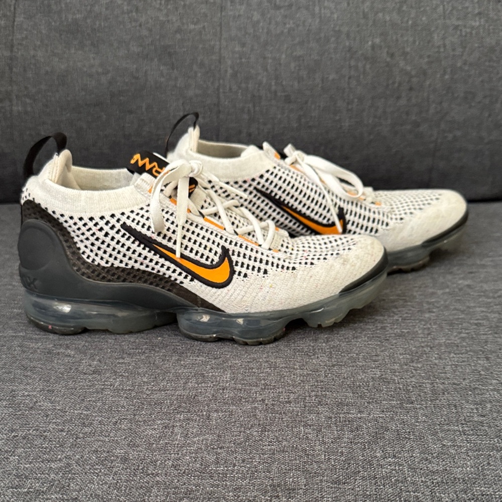 Nike Flyknit Sneakers in White and Black with Orange Accents